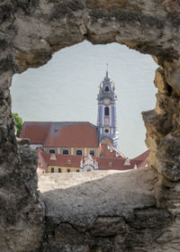 Historic building seen through rocks