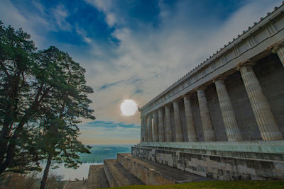 Low angle view of building against cloudy sky