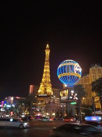 Illuminated city buildings at night