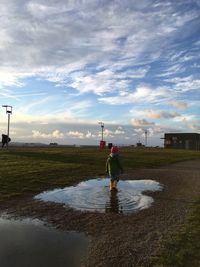 Man standing on land against sky