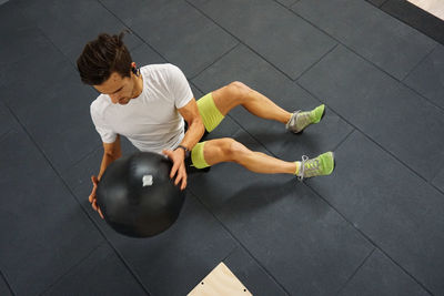 High angle view of man lying on floor