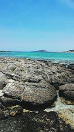 Scenic view of beach against clear sky