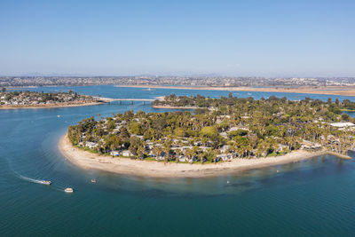 High angle view of sea and city against sky