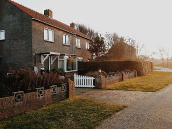 Scenic view of houses against clear sky