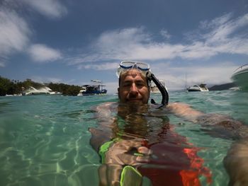 Portrait of man swimming in sea