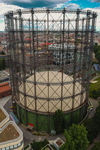 High angle view of construction site in city against sky