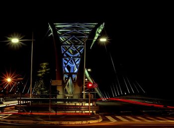 Light trails on suspension bridge at night