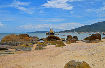 Scenic view of sea against cloudy sky