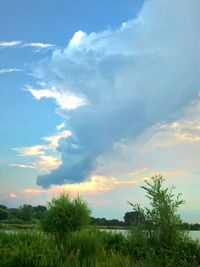 Scenic view of landscape against cloudy sky