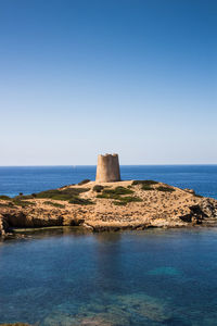 Scenic view of sea against clear blue sky