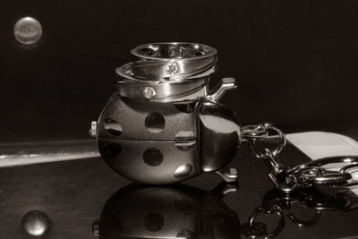 Close-up of glass container on table
