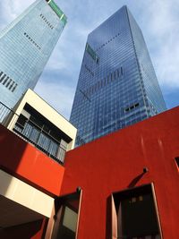 Low angle view of modern buildings against sky