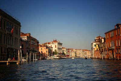 View of buildings in city against clear sky