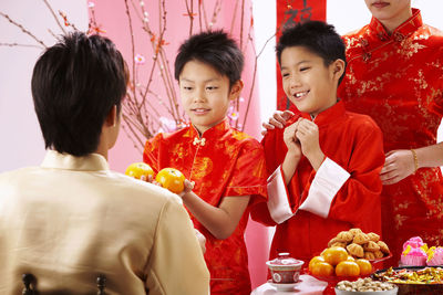 Father greeting family during festival