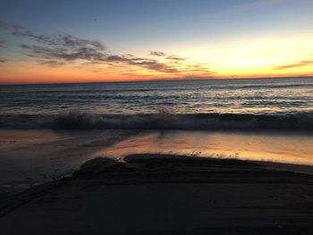 View of calm sea against scenic sky