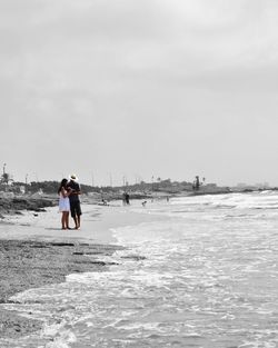 Woman standing on shore