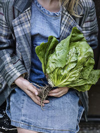 Girl holding lettuce