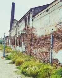 Abandoned building against clear sky