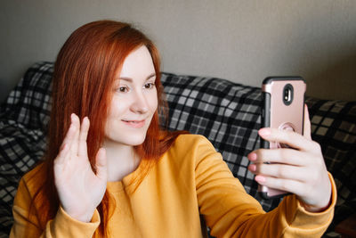 Young woman using mobile phone