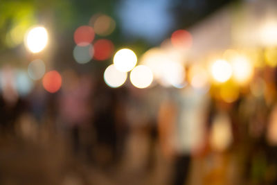 Defocused image of illuminated city at night