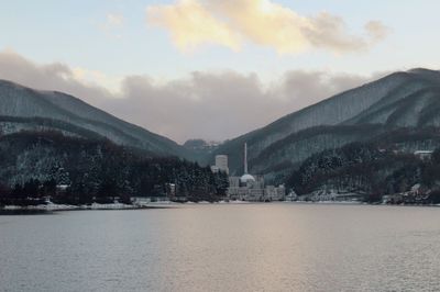 Panoramic view of buildings and mountains against sky