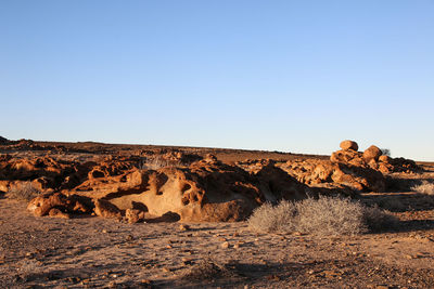 Scenic view of desert against clear sky