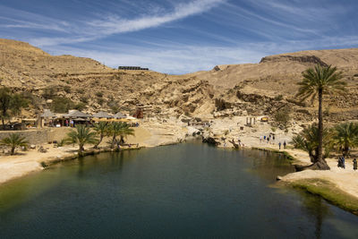Scenic view of land and mountains against sky