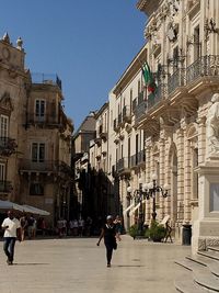 People walking on city street