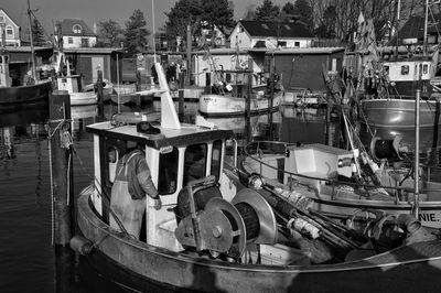 Boats moored at harbor
