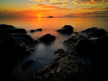 Scenic view of sea against sky during sunset