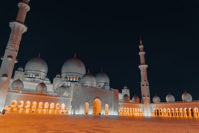 Low angle view of mosque against clear sky