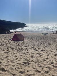 Scenic view of beach against sky