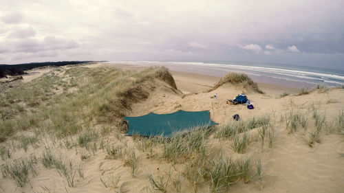 Scenic view of beach against sky