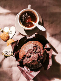 High angle view of coffee and cookies on table