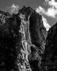 Low angle view of rock formation against sky