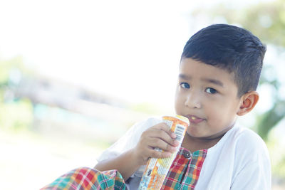 Portrait of boy holding ice cream