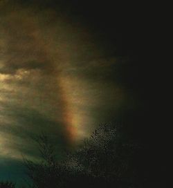 Low angle view of cloudy sky at night