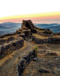 Old ruins against sky during sunset