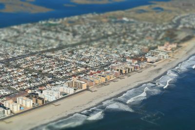 High angle view of townscape by sea