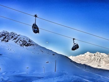 Low angle view of snow covered mountain against sky