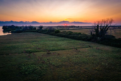 Scenic view of landscape against sky during sunset
