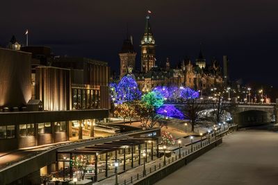 Illuminated buildings in city at night