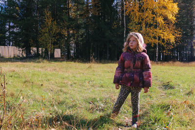 Full length of woman in park during autumn