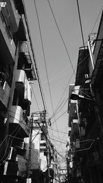 Low angle view of electricity pylon against sky