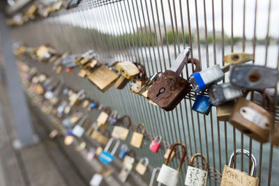 Close-up of love locks on railing