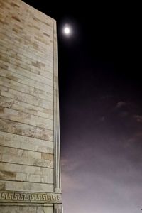 Low angle view of building against sky at night