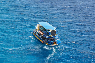 High angle view of boat sailing in sea