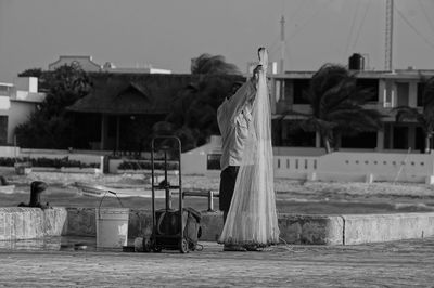 Clothes drying on clothesline against built structures