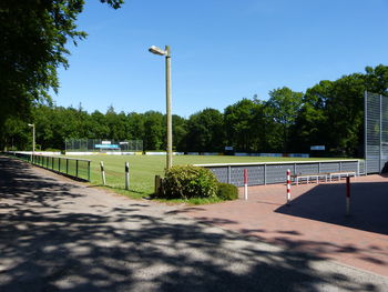 Scenic view of soccer field against clear sky