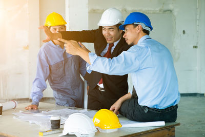 Rear view of people working
